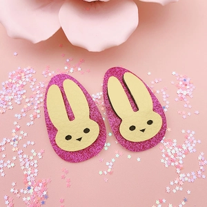 Cute Easter bunny hair clips with pink glitter sequins and cream leather rabbit ears