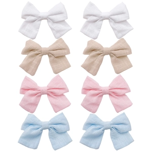 Set of 8 solid color linen bow hair clips for girls in white, beige, pink and blue tones