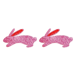 Close-up of pink glitter rabbit hair clips with shiny sequins for girls and babies