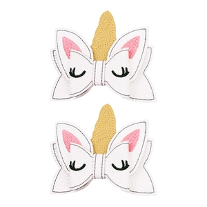 Pair of white PU leather unicorn bow hair clips with gold horns and eyelash embroidery