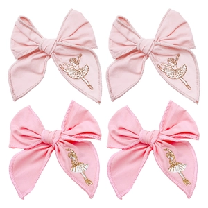 Pink ribbon hair clips with ballerina embroidery and sparkling sequins for girls