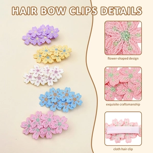 Detail showing high-quality embroidered floral hair clips with fabric wrapped metal fasteners