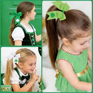 Detailed close-up of green shamrock ribbon hair bows for kids St. Patrick's Day celebration