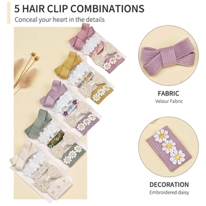 Détail de nœuds en velours et broderie marguerite sur set de barrettes fleurs