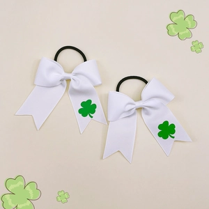 Detail of white grosgrain ribbon hair bows with green shamrock prints for St. Patrick's Day