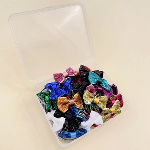 Set di fermagli per capelli con fiocchi glitterati e elastici in scatola trasparente