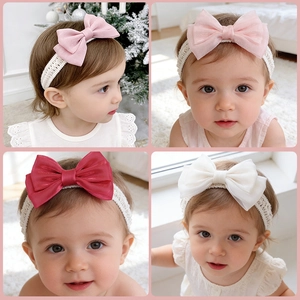 Detail of pink, red and white lace baby headbands with large organza bow for infants