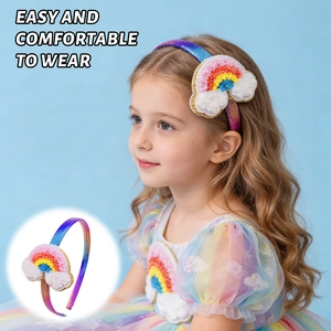 Detail of glitter rainbow headband with plush clouds for girls birthday party wear