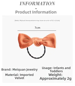 Detail of soft orange velvet bow hair tie for infants with 7cm size and elastic band