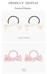 Close-up of velvet bow hair ties in pearl white and tender pink for elegant styling