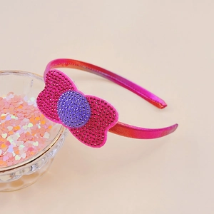 Detail of pink and purple gradient bow headband with rhinestones for girls