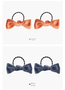 Detailed view of caramel and blue-grey velvet bow hair ties with durable elastic bands