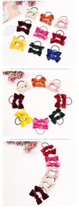 Close-up of colorful velvet bow hair ties set for kids in nine assorted vibrant shades