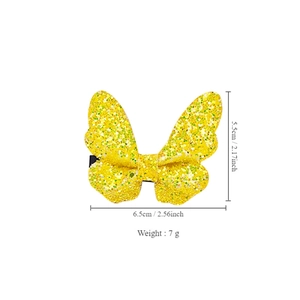 Sparkly butterfly hair clip with green glitter and yellow base for performance and hair styling