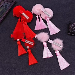 Chinese New Year hair clips with oversized plush balls and long silk tassels for kids
