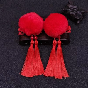 Traditional Chinese New Year hair clips with red pompom and long silk tassels for kids
