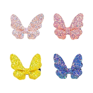 Set of four glittering butterfly hair clips in pink, rose, yellow, and blue colors