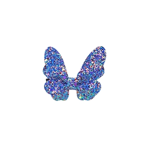 Macro shot of blue glitter butterfly hair clip with shimmering rainbow sparkles