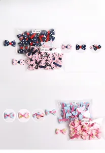 Detail view of 40-piece bow hair clip set featuring polka dots and floral patterns in bags