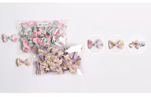 Detail view of colorful floral bow hair clips with 20 pieces in clear packaging