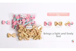 Detail showing 20-piece sets of pink wave and beige floral bow clips in clear packaging
