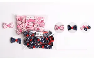 Detail view of 20 pieces star pattern ribbon bow clips for babies in pink and navy