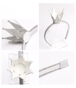Close-up of silver glitter crown headband with heart cutouts and white lace detail