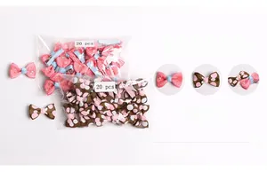 Detail view of 20-piece set featuring pink floral and brown polka dot bow hair clips