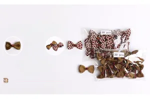 Macro detail of two 20-piece packs featuring brown and giraffe pattern bow hair clips