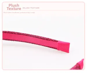 Detail of rose pink glitter headband showing comfortable ribbon-wrapped ends and craftsmanship
