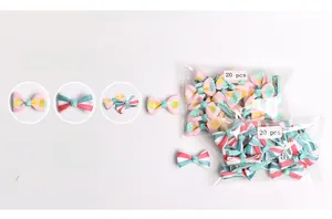 Detail of 20 pieces floral bow hair clips in packaging with secure metal duckbill clips