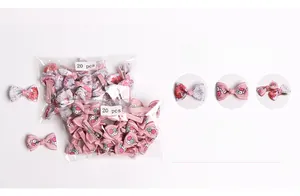 Detailed view of 20 pieces floral pattern bow hair clips for babies in soft pink and grey