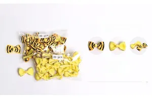 Close-up of yellow floral and tiger print hair clips for babies with ribbon texture