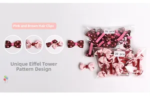 Detail of 20-piece pack featuring pink and brown polka dot and tower print bow hair clips