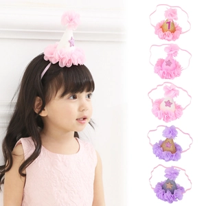 Detail of sequined birthday cone headbands with tulle ruffles and number 1 for babies