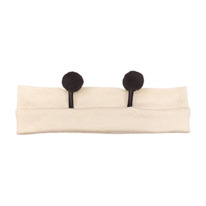 Macro detail of beige ribbed cotton baby headband with cute black antenna pom-poms decoration