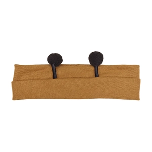 Close-up of ginger yellow knitted baby headband with black pom-pom antenna details