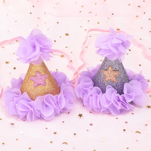 Golden and purple glitter birthday party hats with tulle flowers and elastic straps