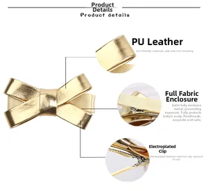 Détail d'une pince à cheveux avec nœud en cuir PU doré et protection en tissu doux