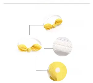Detailed views of yellow polka dot baby headband showing bow design and soft cotton fabric