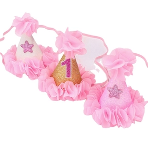 Three glittering 1st birthday party cone hats with pink chiffon trim and star sequins