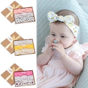 Pink and floral baby headband gift set featuring three elastic bows in a craft paper box