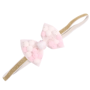 Detailed view of baby headband with golden glitter band and pompom-filled tulle bow