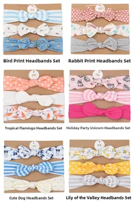Detail view of handmade baby bow headband sets featuring cute animal and floral prints