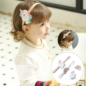 Detailed view of elastic unicorn and rainbow headbands with glitter for baby girls