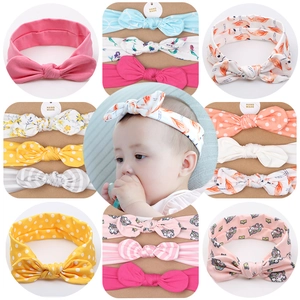 Three-pack of soft cotton baby headbands with colorful prints and oversized bows