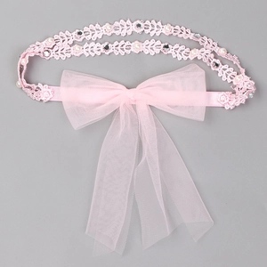 Bandeau bébé en dentelle rose avec grand nœud en tulle, perles et strass brillants