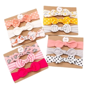 3-piece baby bow headband set with floral, striped, and polka dot patterns on display cards