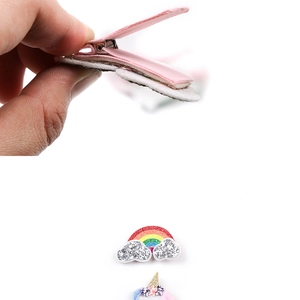 Detail of baby unicorn hair clip showing anti-slip metal crocodile clip and soft felt backing
