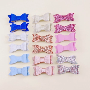 Set of 18 glitter and litchi leather bow hair clips for girls in various bright colors